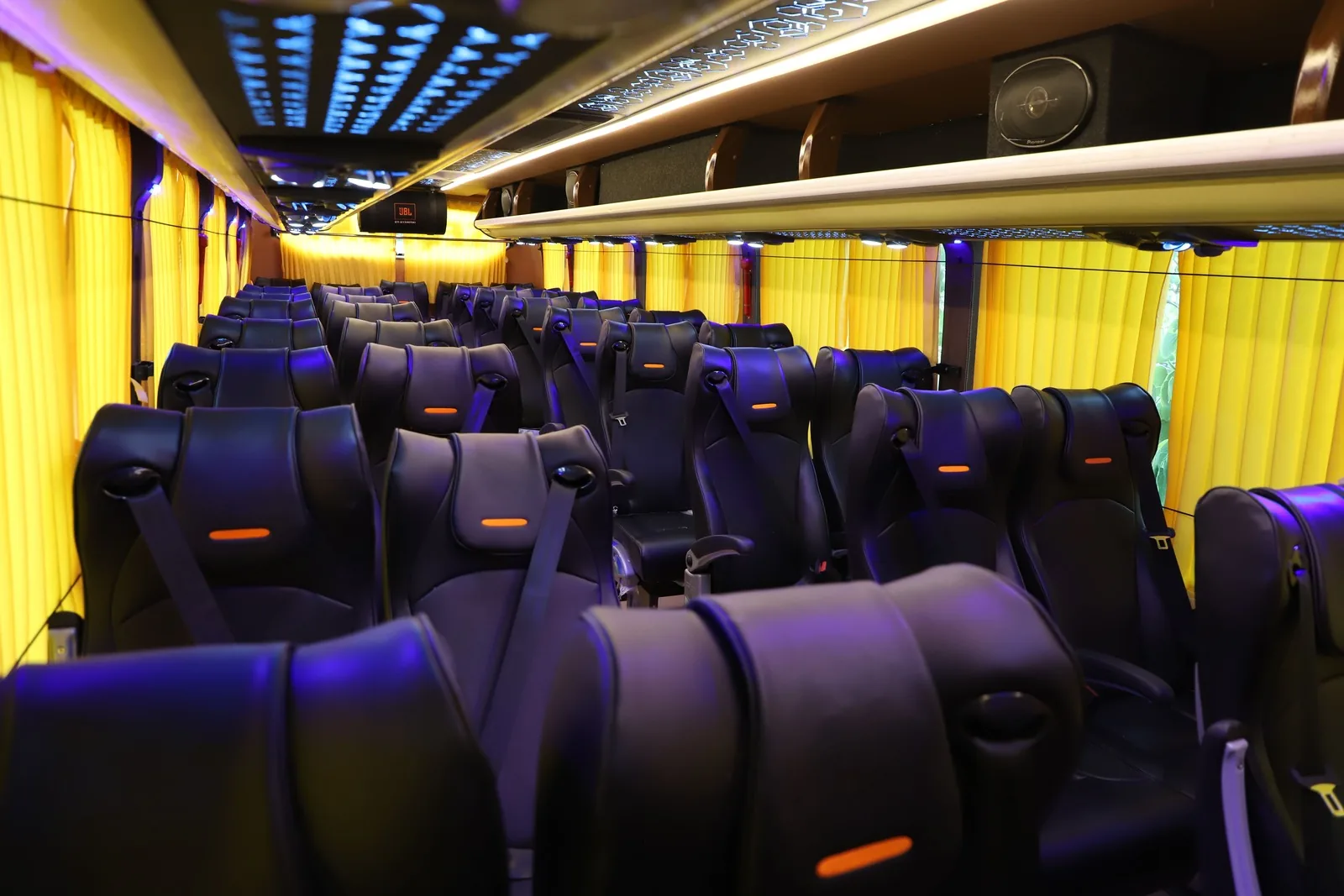Bus interior showing passenger seats from the front