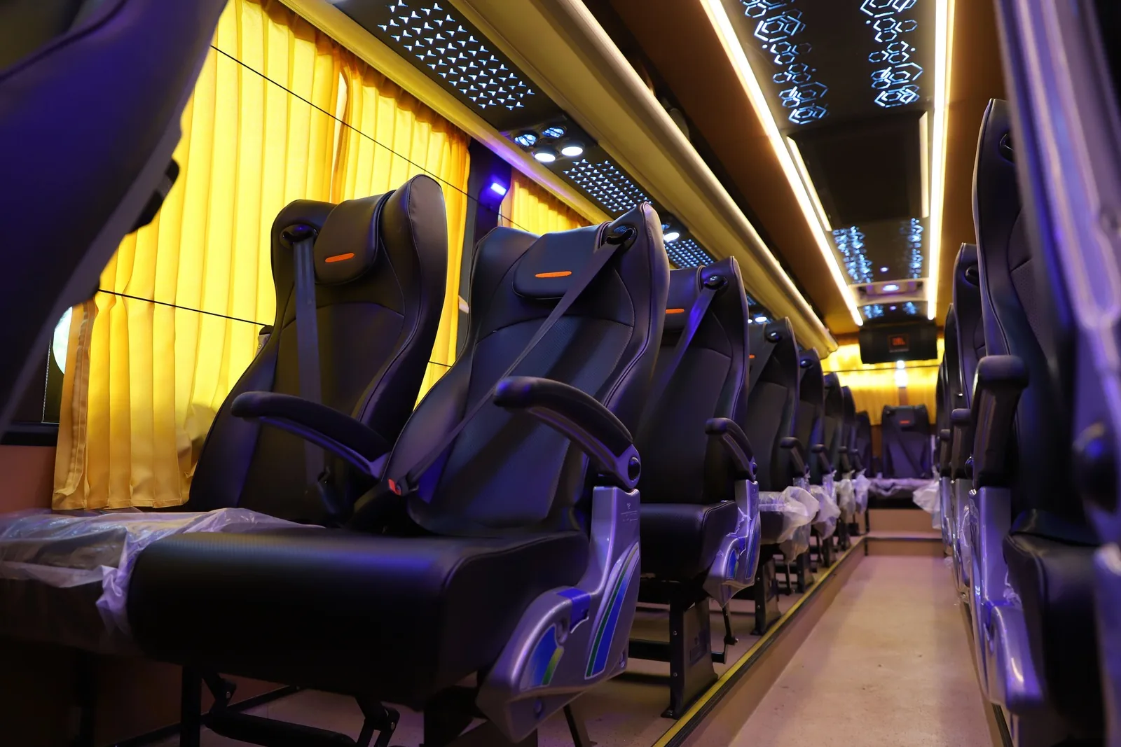 Bus passenger seats, centre aisle and interior ceiling lights